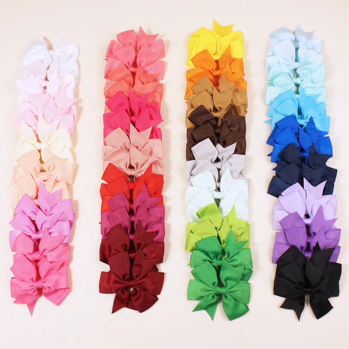 Assorted 3 inch grosgrain ribbon baby hair bows with alligator clips in multiple colours