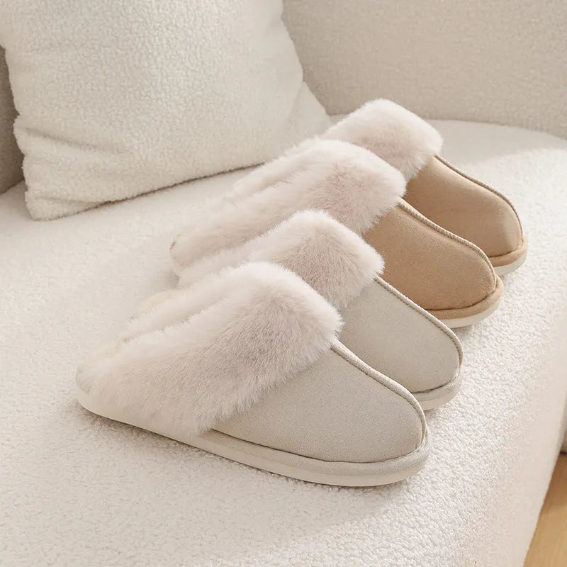 Women's plush winter slippers in grey with a round toe, flat heel, and non-slip PVC sole.