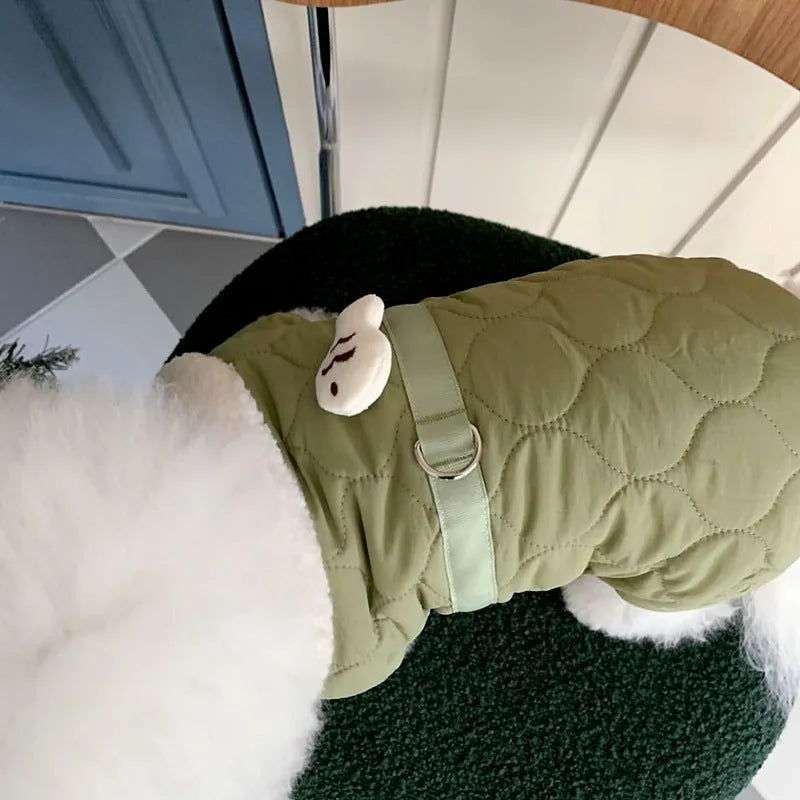 Dog wearing a four-legged cotton-padded winter coat in Small Green Fish pattern