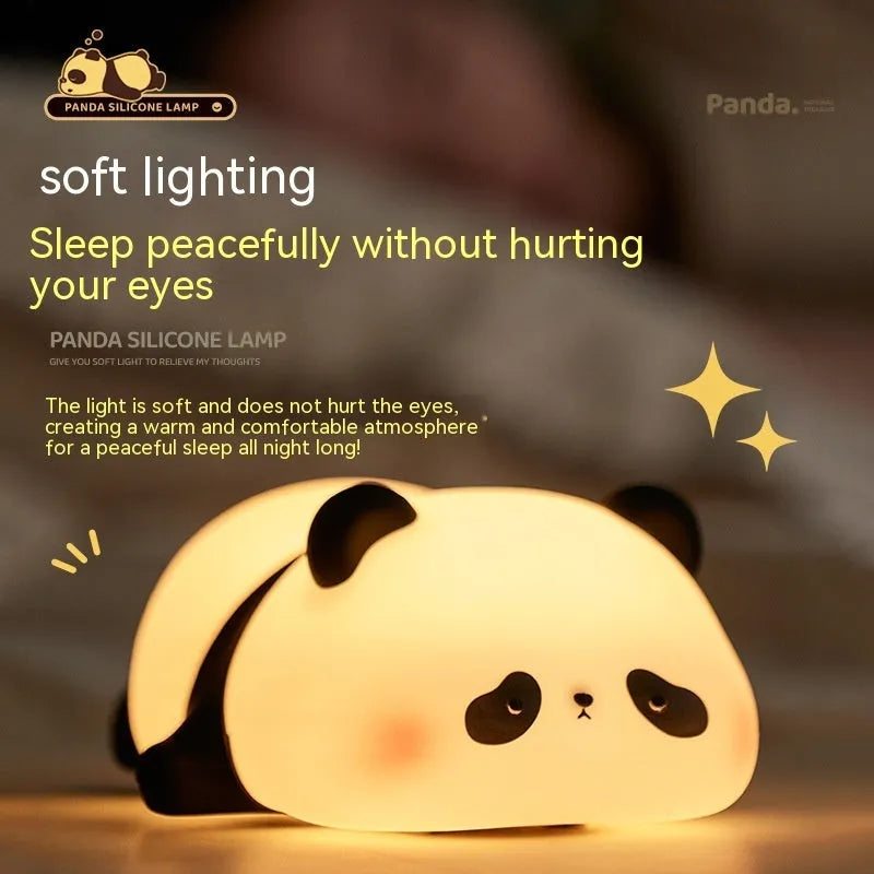 Panda-shaped night light with black and white silicone construction showing LED glow
