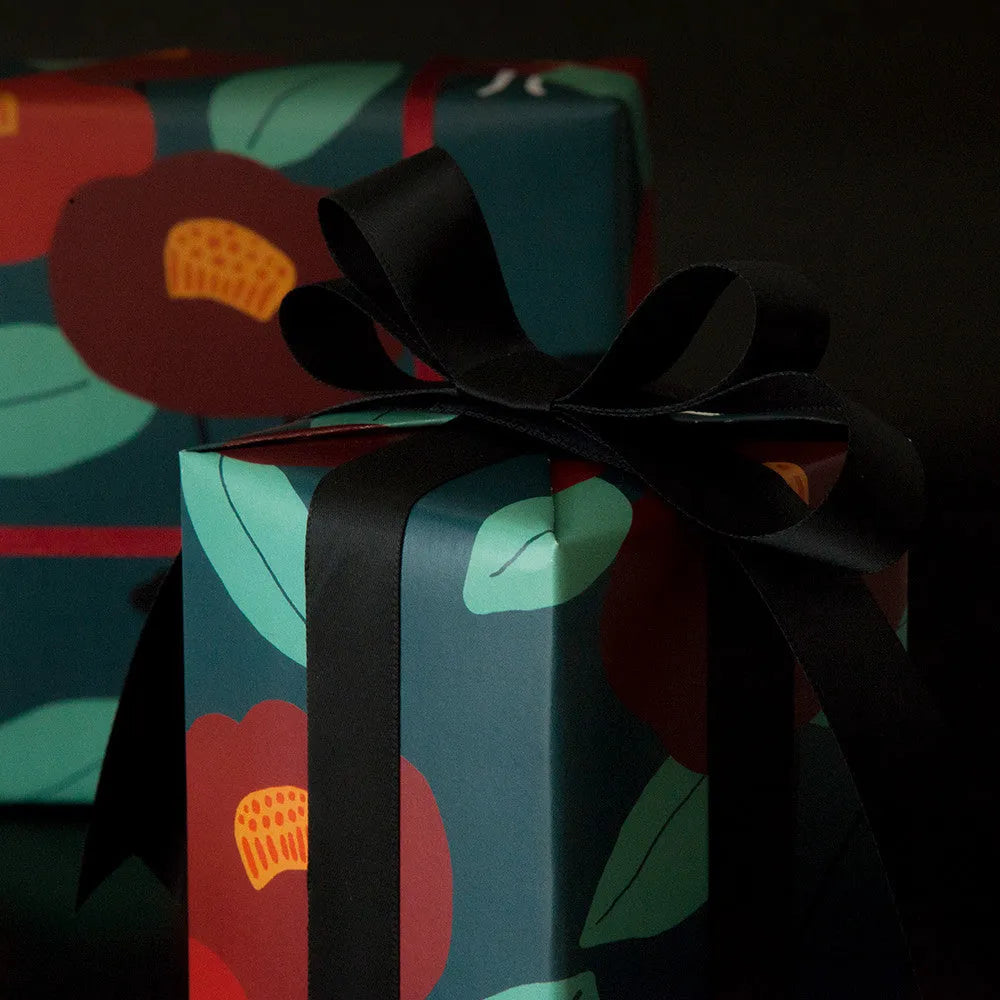 Green waterproof gift wrapping paper with camellia leaflet and black ribbon for gift box
