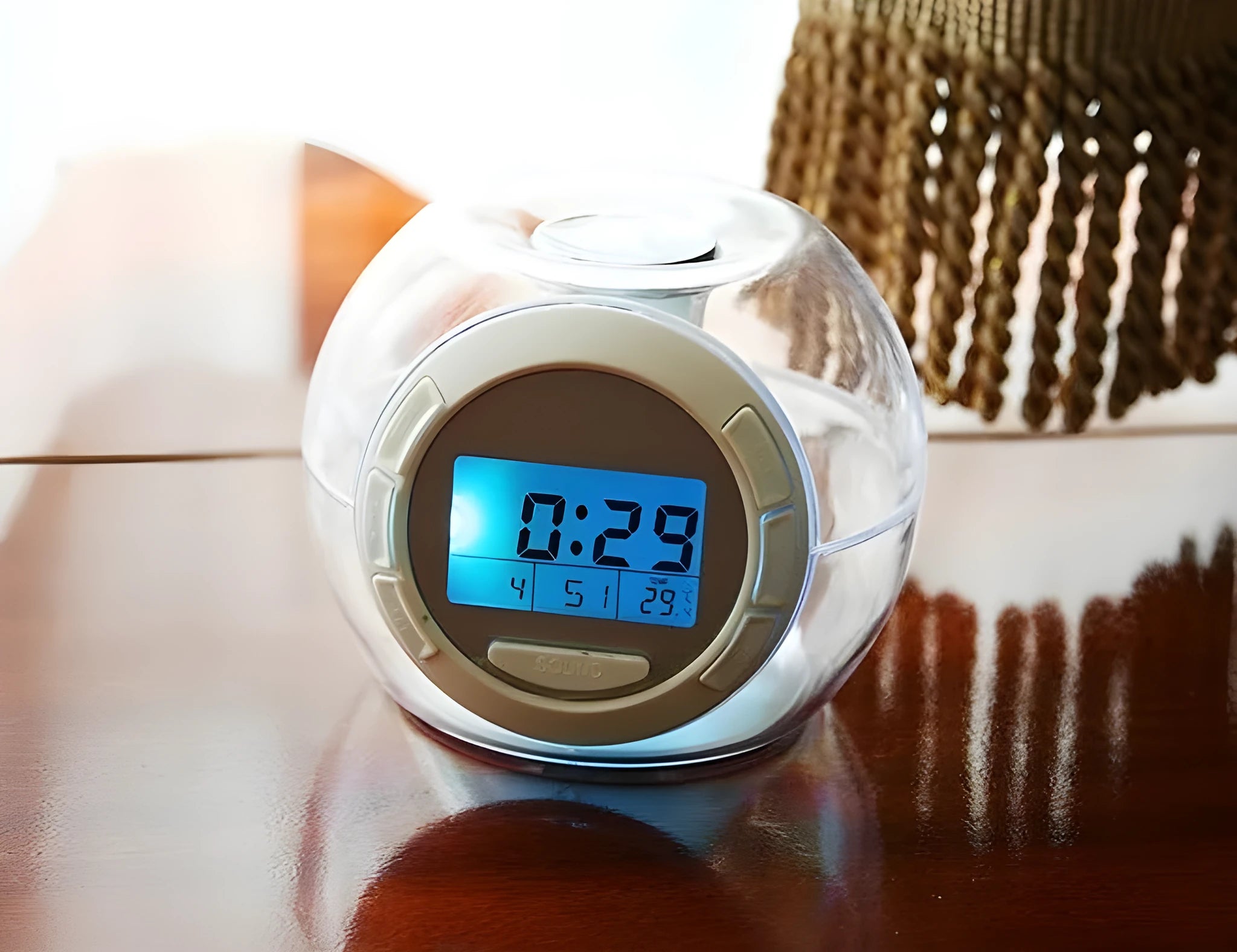 White colourful natural sound alarm clock with LCD display showing time and temperature