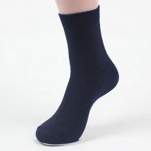 Men's bamboo fibre ankle socks in black with a small square pattern, laid flat.