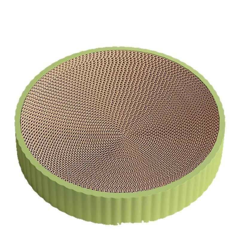 Green round cat scratching board with corrugated paper surface measuring 55cm diameter