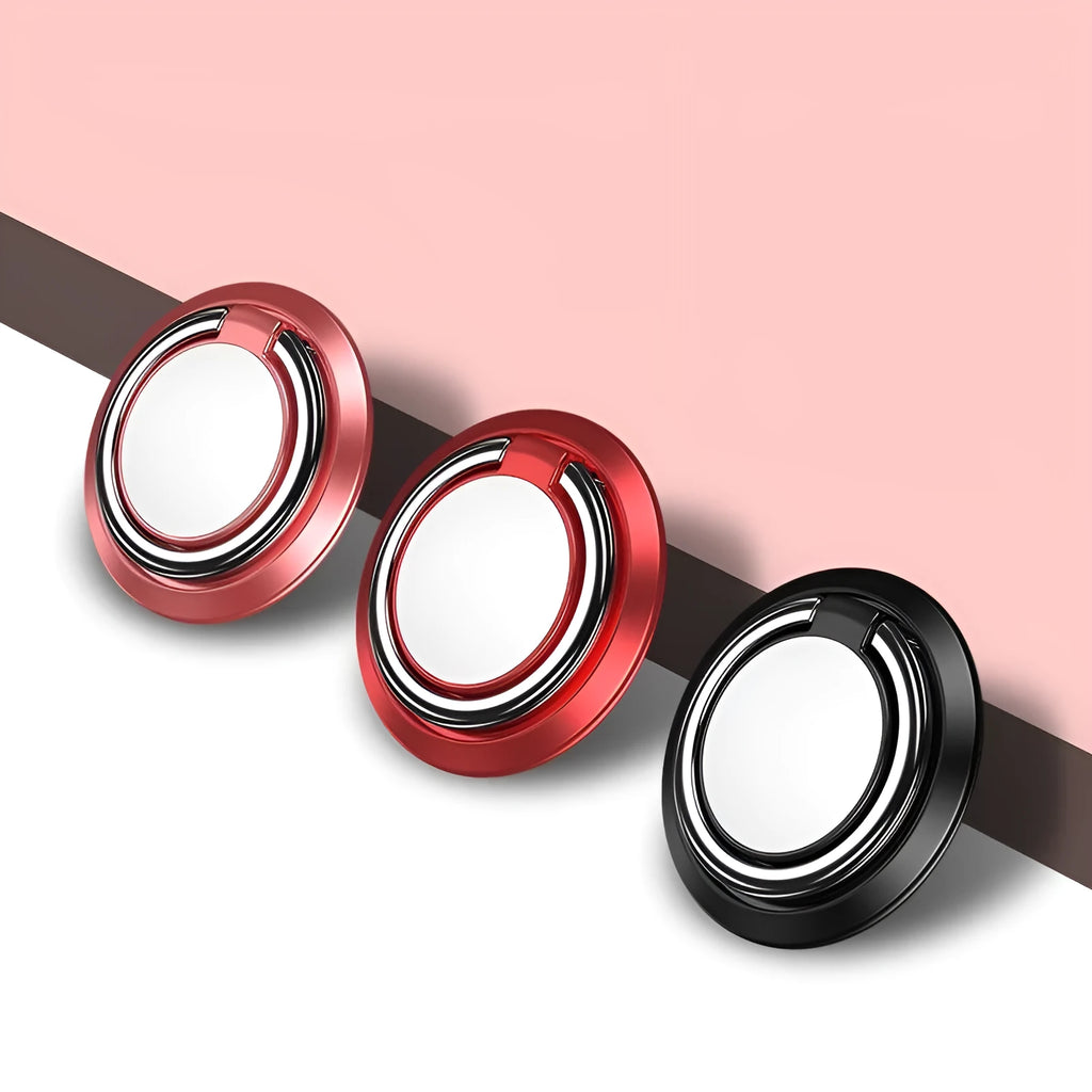 Magnetic suction ring car phone holder in black on car dashboard holding a smartphone