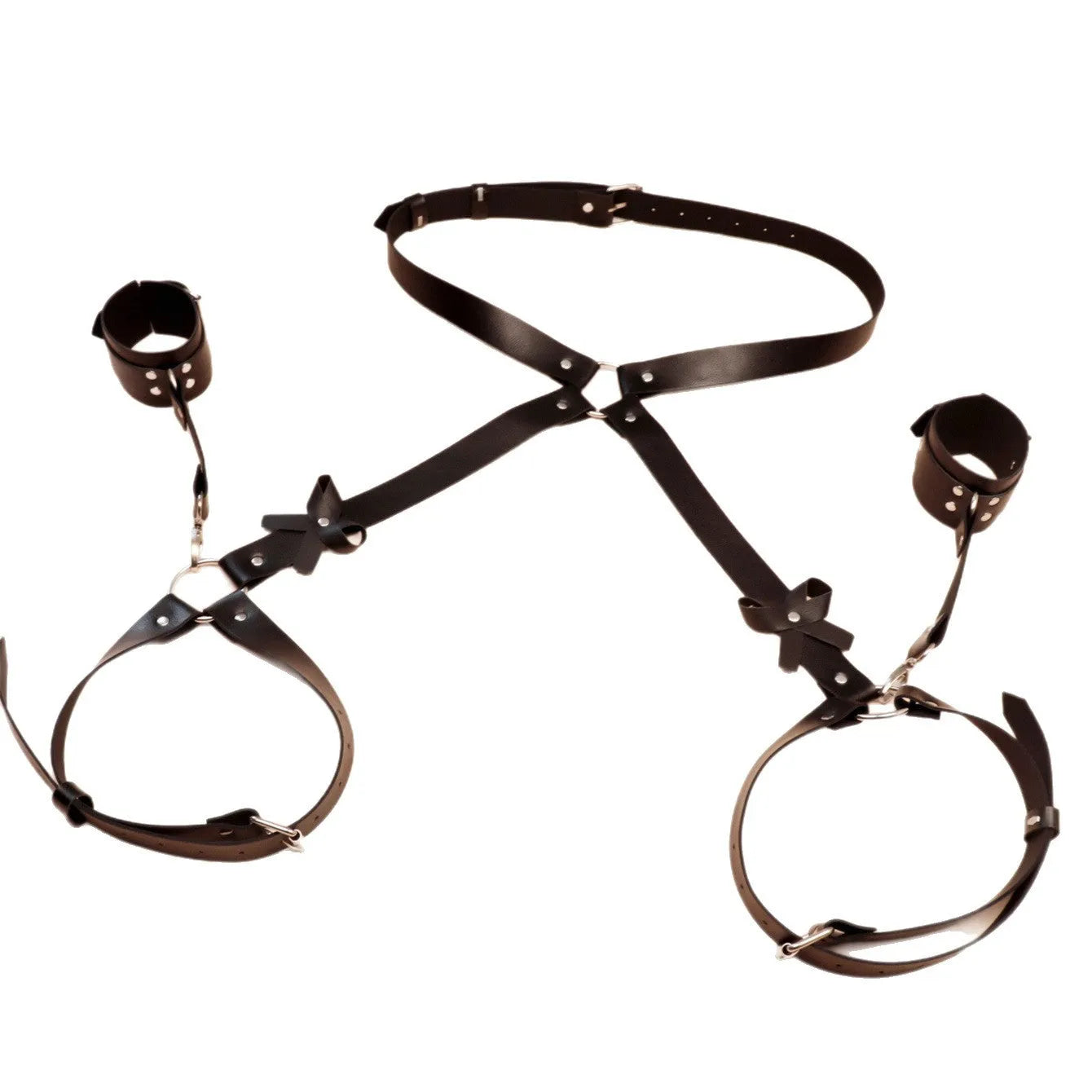 Black leather-look belt with metal buckle and bow detail, handcuffs from same set, on a dark surface