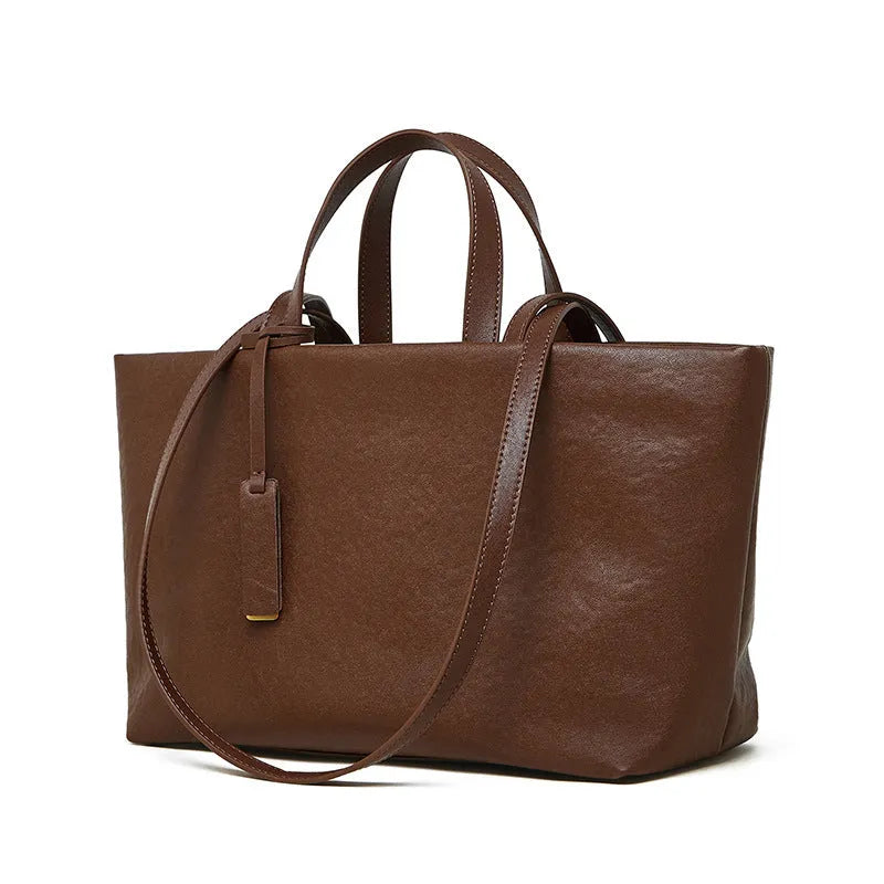 Genuine leather women's underarm shoulder bag in brown, 32x13x22cm, with sewing line detail
