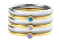A titanium steel ring with an engraved December birthstone in a geometric design.