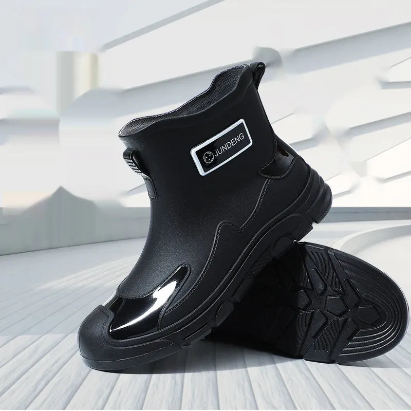Short tube PVC waterproof boots in black, black and yellow, or khaki with flat heel and round toe.
