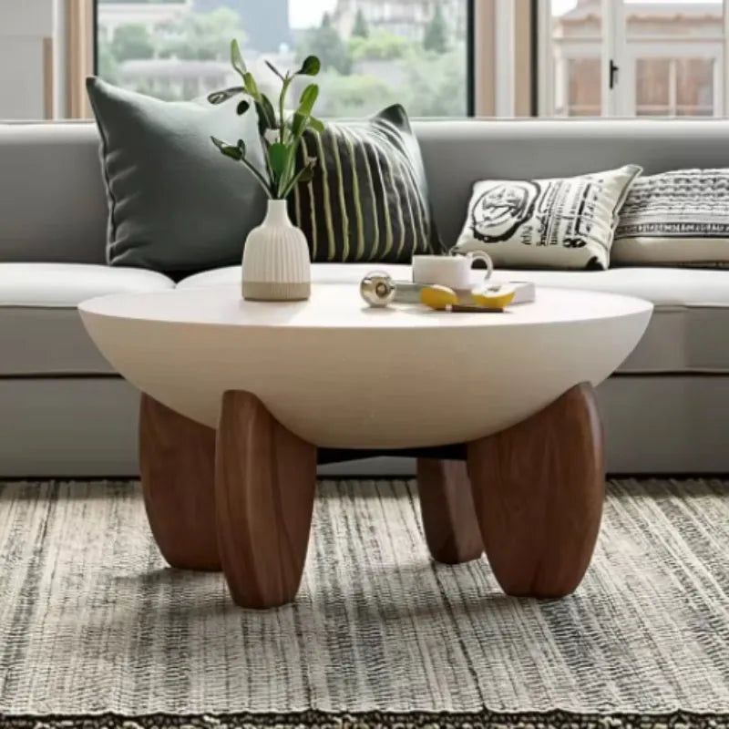 White solid wood coffee table with adjustable legs and storage compartment.