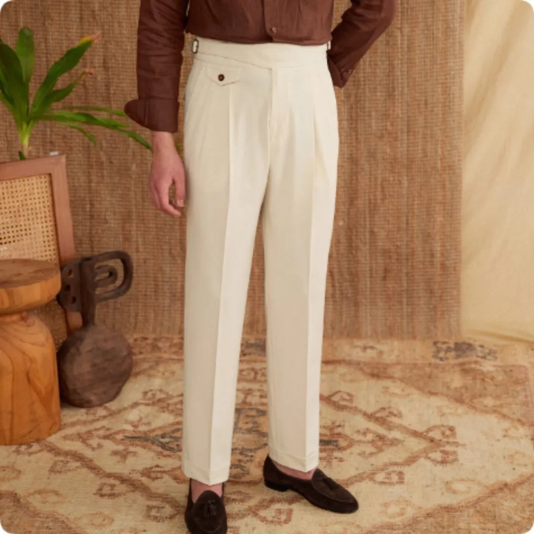 Man wearing dark grey slim fit straight leg polyester business trousers.