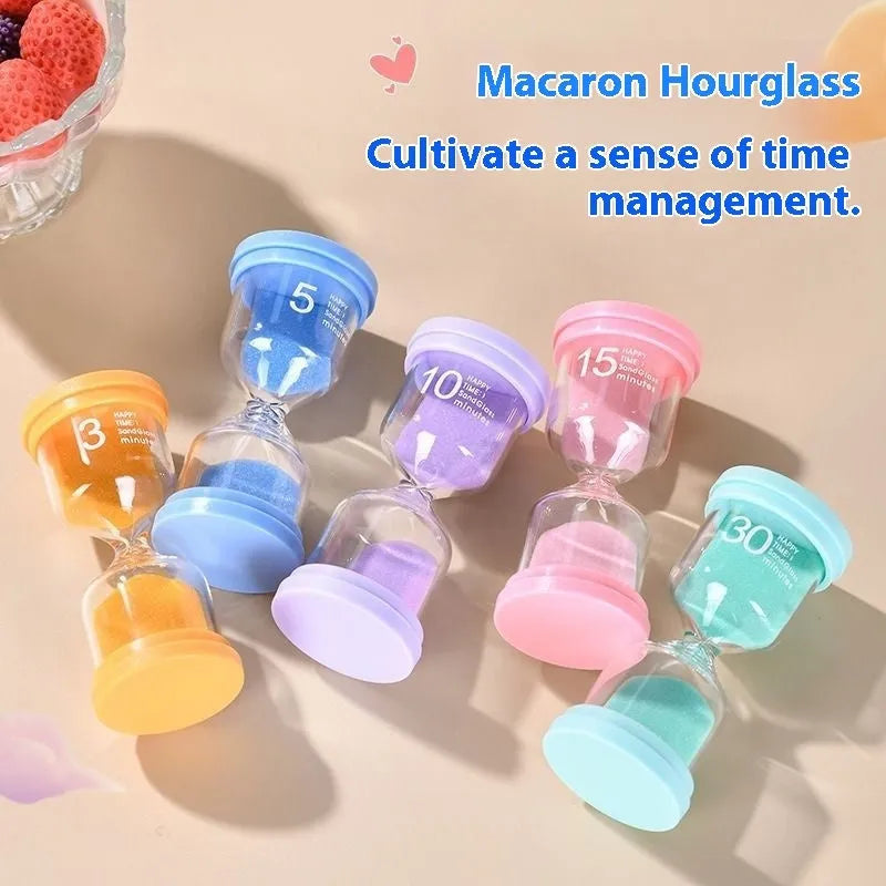 Handmade glass sand timer with blue sand, showing modern simplicity style on a desk.