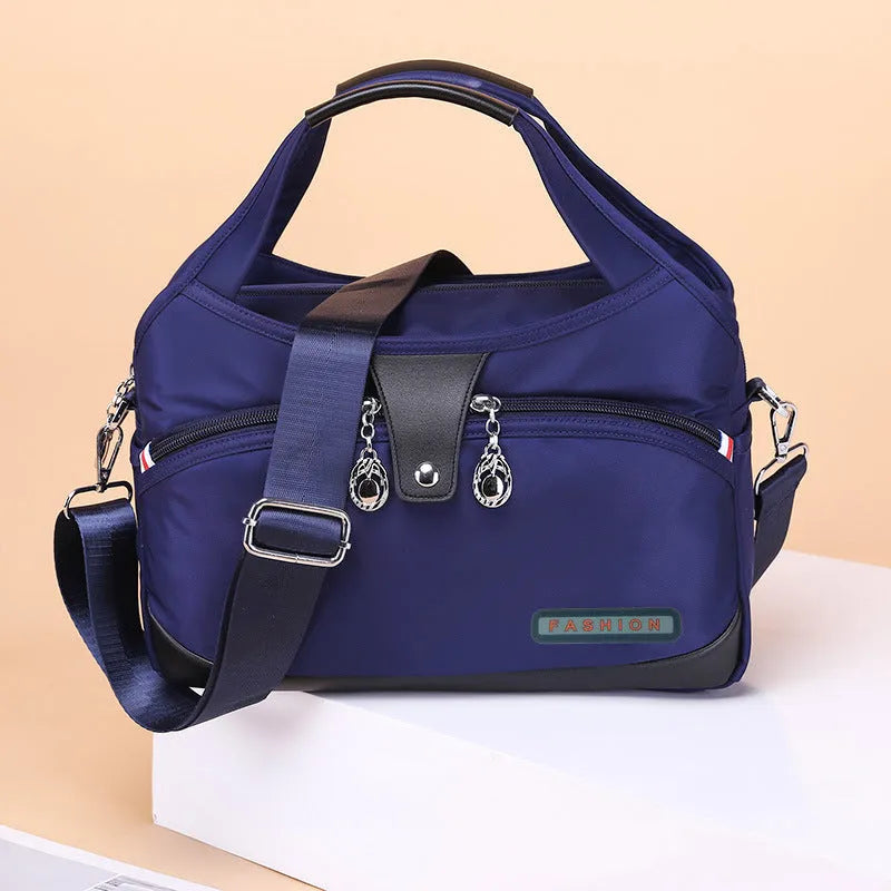 Women's anti-theft crossbody shoulder bag in Oxford cloth with multiple pockets and adjustable strap