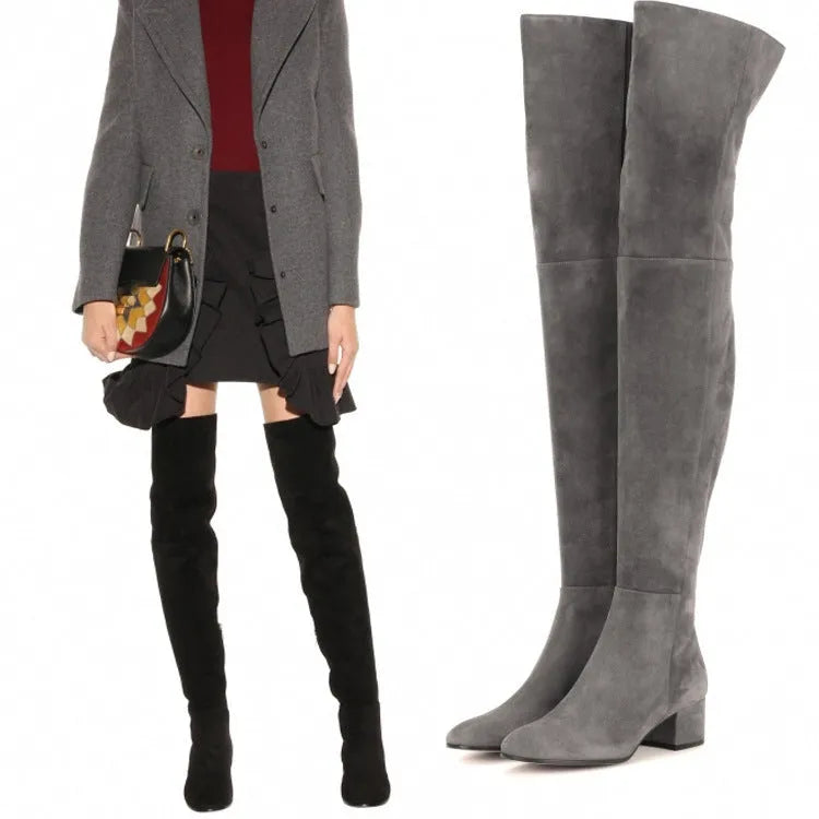 Grey suede women's flat over the knee boots with a pointed toe and thick low rubber sole.
