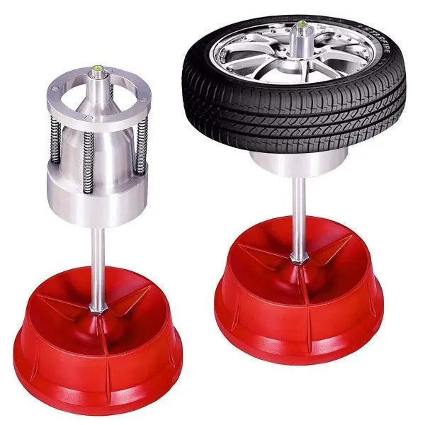 Portable hub balancer with aluminium head and enamel-finished base for balancing car and truck tyres.