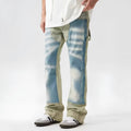 Yellow and blue retro patchwork splash-ink damaged design jeans on a mid-waist fit.