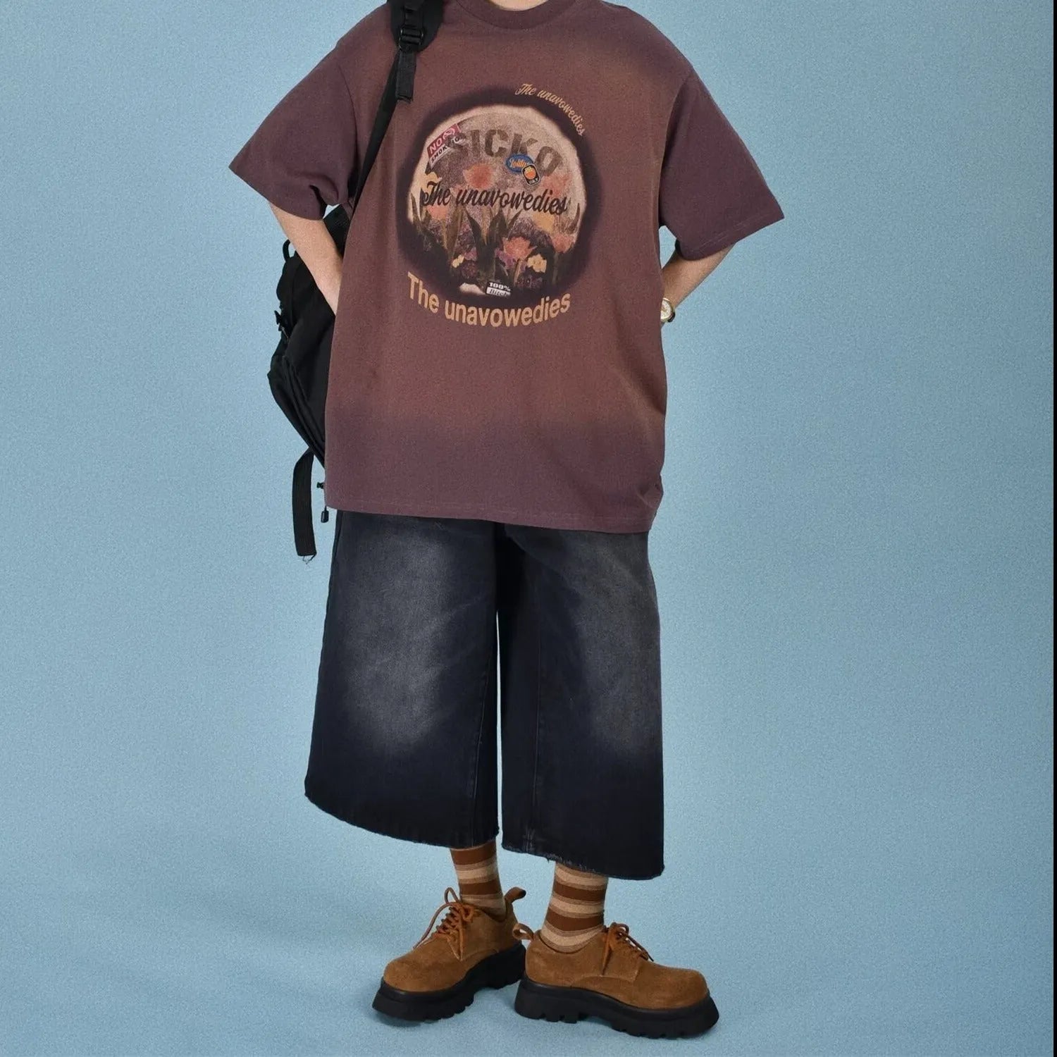 A pair of men's light blue denim shorts with a loose straight-leg cut on a neutral background.