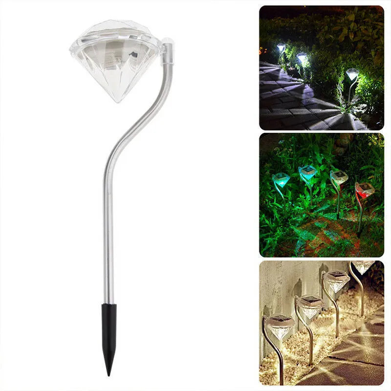 White solar-powered diamond-shaped garden spotlight with adjustable head on a stake.