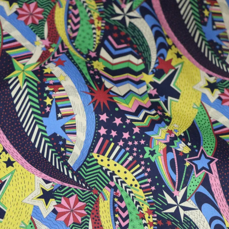Blue cotton fabric with plant and flower digital print showing 145cm width measurement