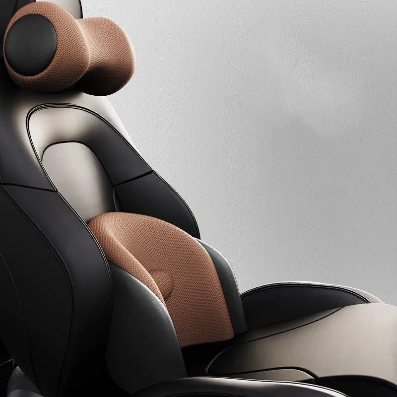 Car seat massage cushion and headrest set made from memory foam in a neutral colour.