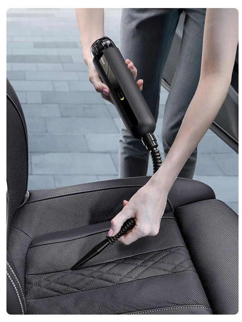 Compact handheld wireless car vacuum cleaner in black, white, or green, showing suction nozzle and blowing hose.