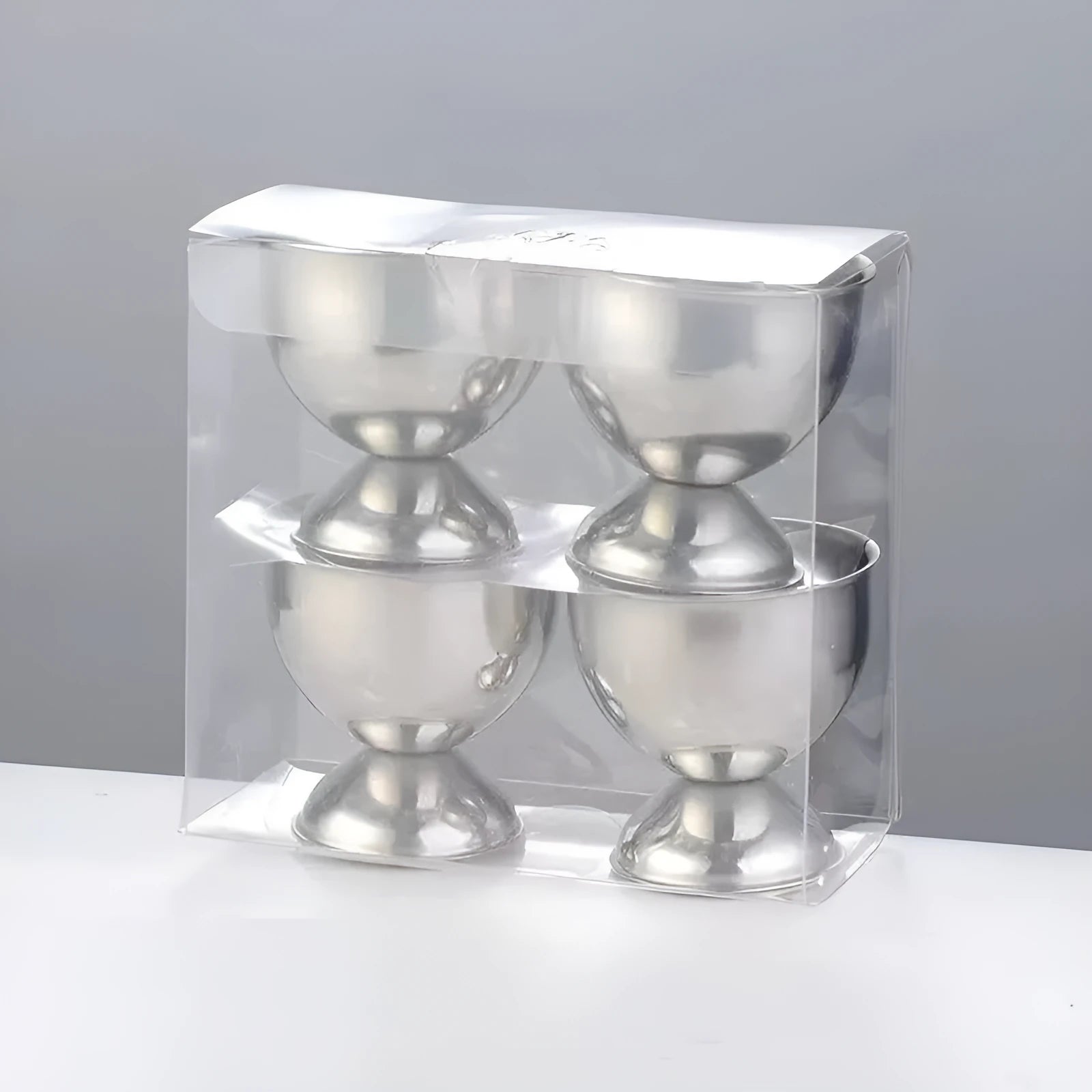 Creative stainless steel egg bracket in silver finish, holding eggs on a kitchen countertop.