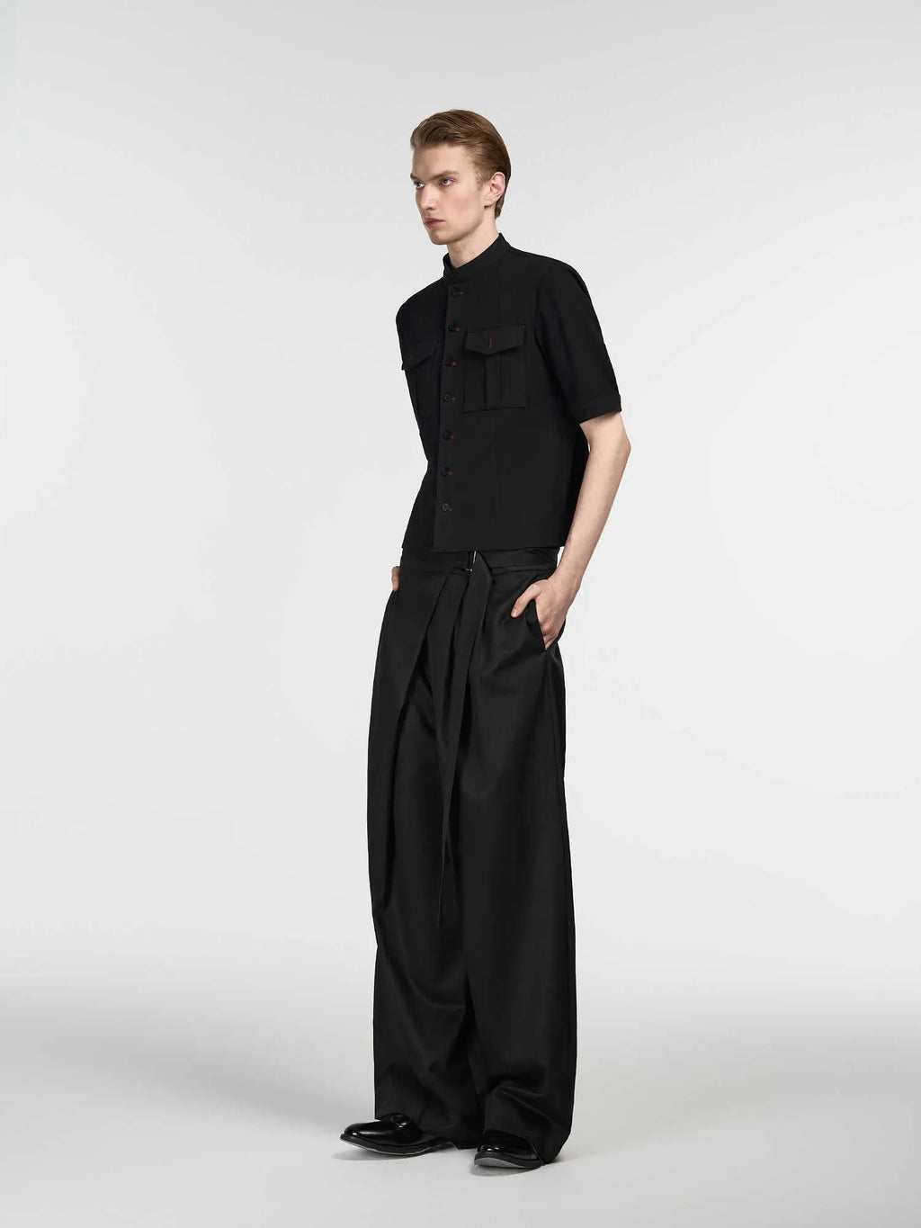 Black straight-leg trousers with adjustable waistband and single pleat design in Tencel cotton fabric