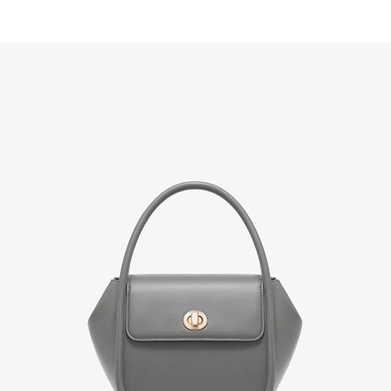 Genuine cow leather wing-shaped tote bag with buckle detail and cross-body shoulder strap