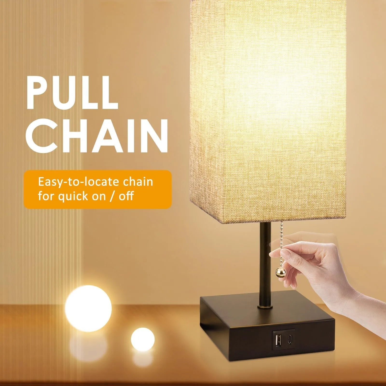 Small bedside table lamp with beige fabric shade and black base on a nightstand