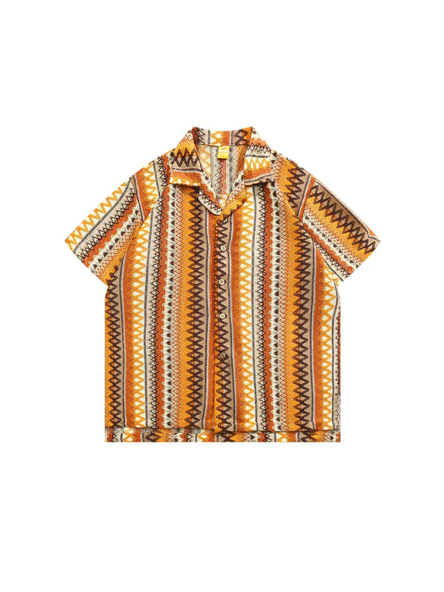 Man wearing a loose-fit ethnic style woven shirt with a Cuban collar and contrast colours.