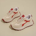 Women's solid colour low-top platform trainers with lace-up front and flat rubber sole