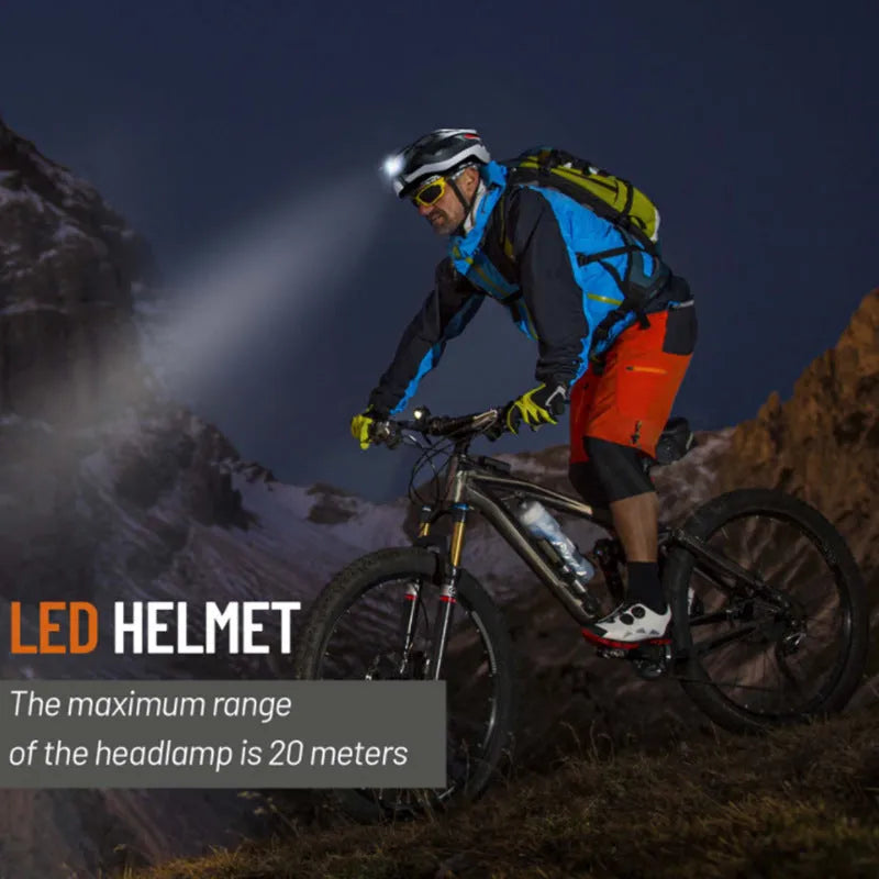 Black and grey smart riding helmet with integrated warning light on the rear, showing USB charging port.
