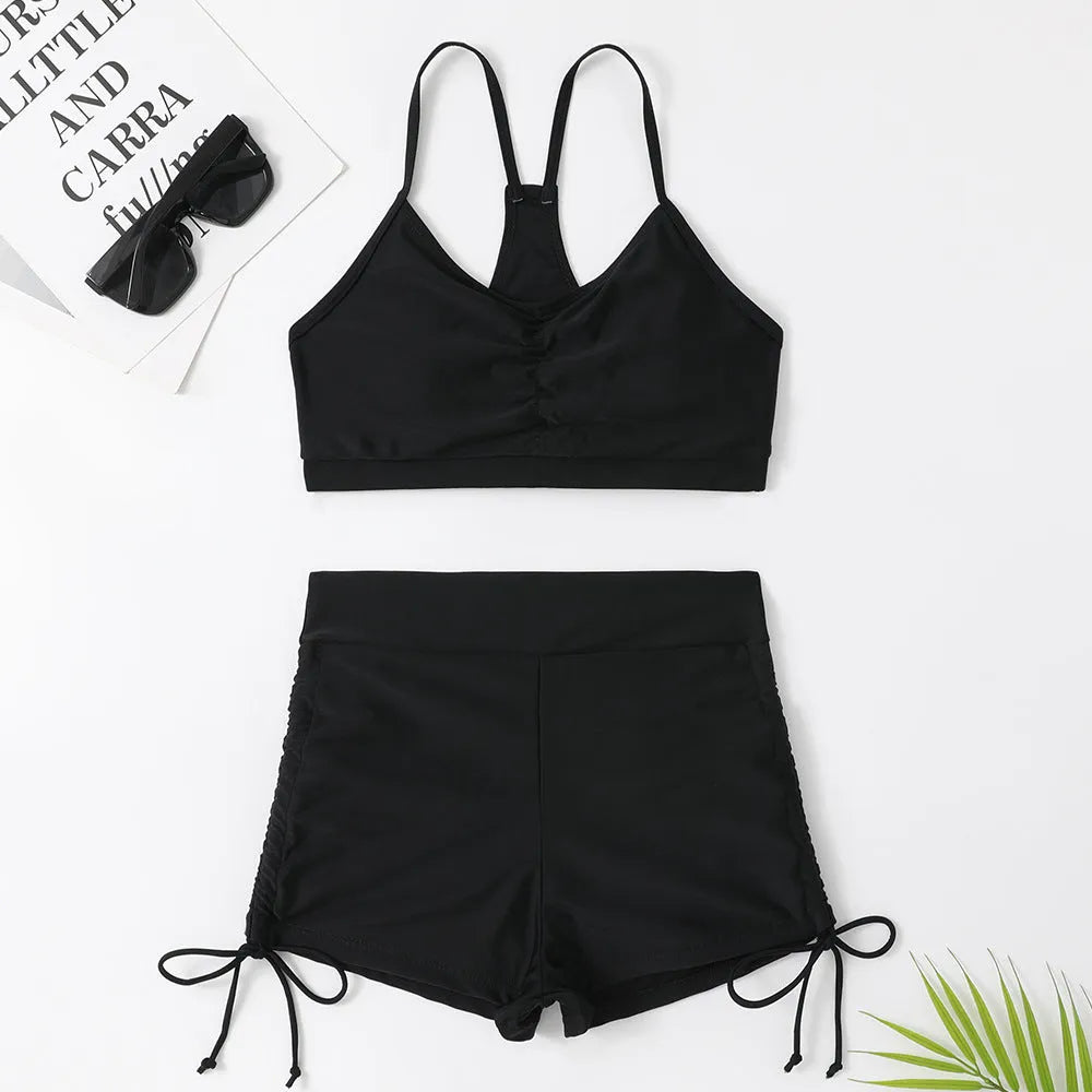 Women's black and violet high waist split bikini swimsuit for surfing and swimming.