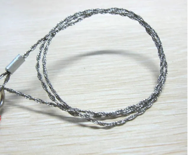 Stainless steel survival wire saw with thumb rings, showing extended length of 70cm.