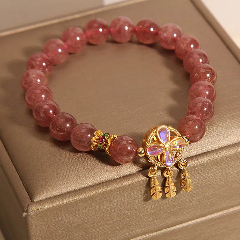 Women's adjustable strawberry quartz bracelet with four leaf dream catcher ball pendant and crystal beads