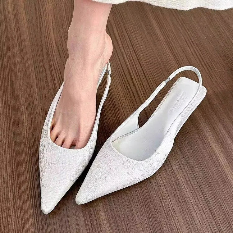 White faux suede mid heel stiletto court shoes with Mary Jane strap, pointed toe, and rubber sole, sizes 35-39
