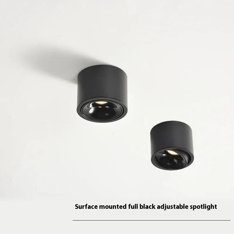 Round surface-mounted adjustable ultra-thin LED spotlight with aluminium housing, white finish, on ceiling