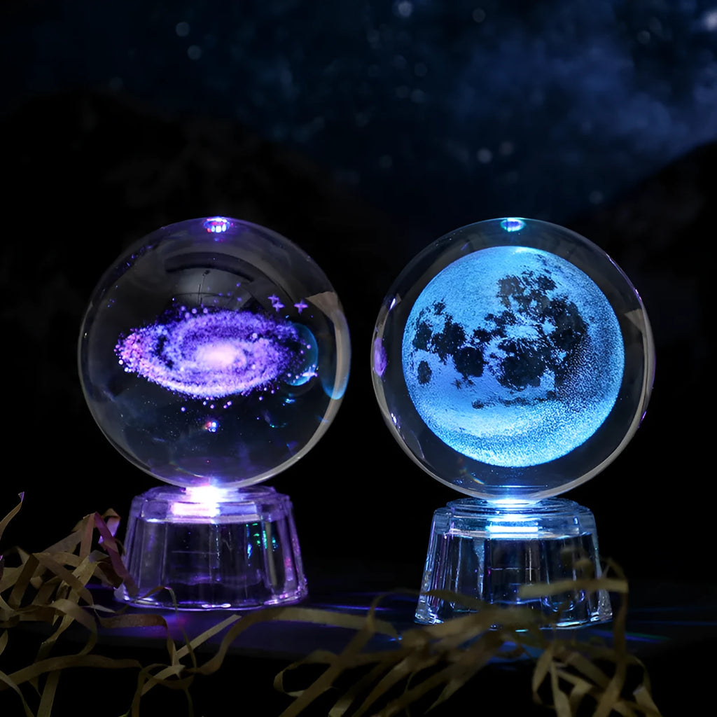 Transparent crystal ball ornament with inner carving on a table, 6cm in diameter with a modern base.
