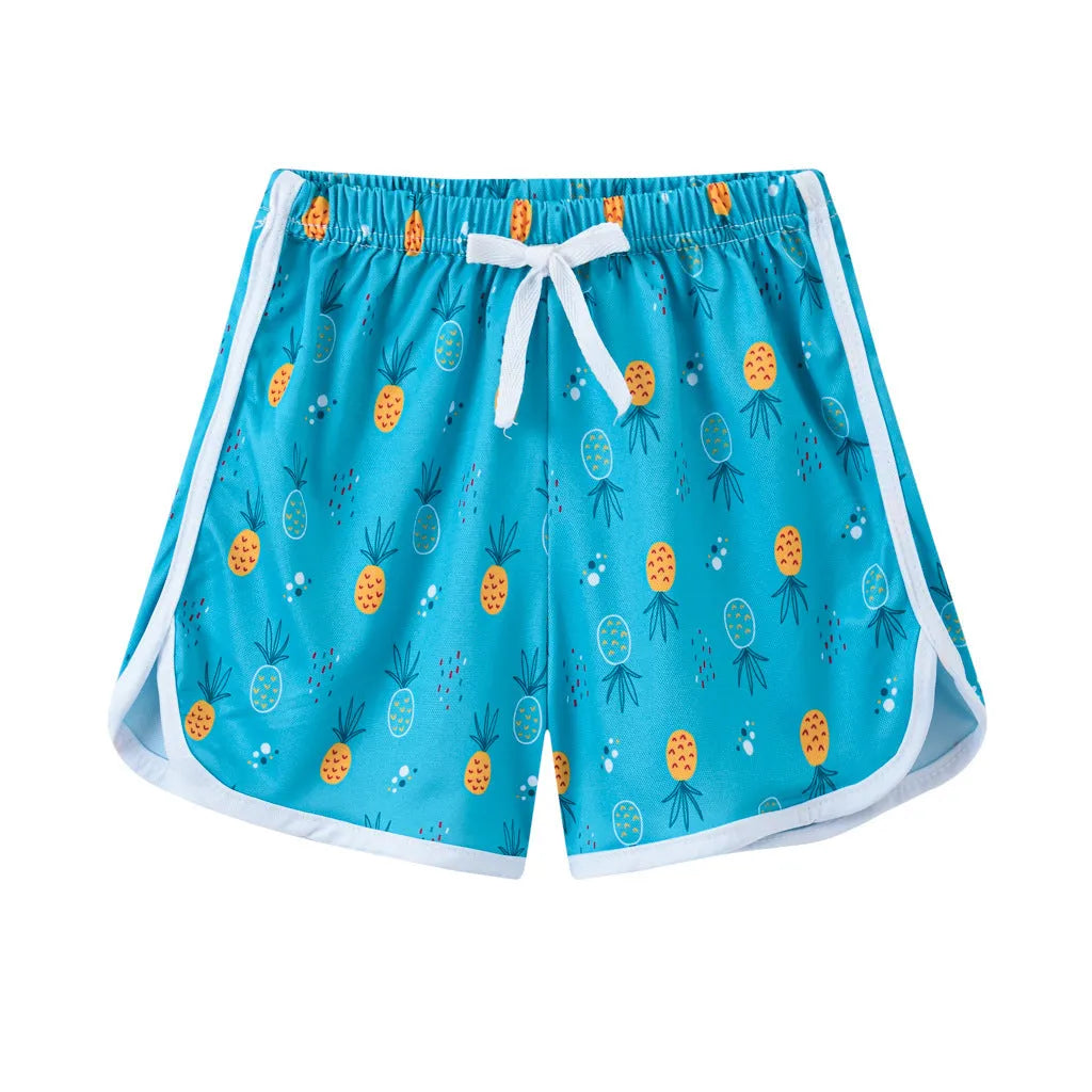 Children's patterned polyester shorts in various colours and prints for beach wear.
