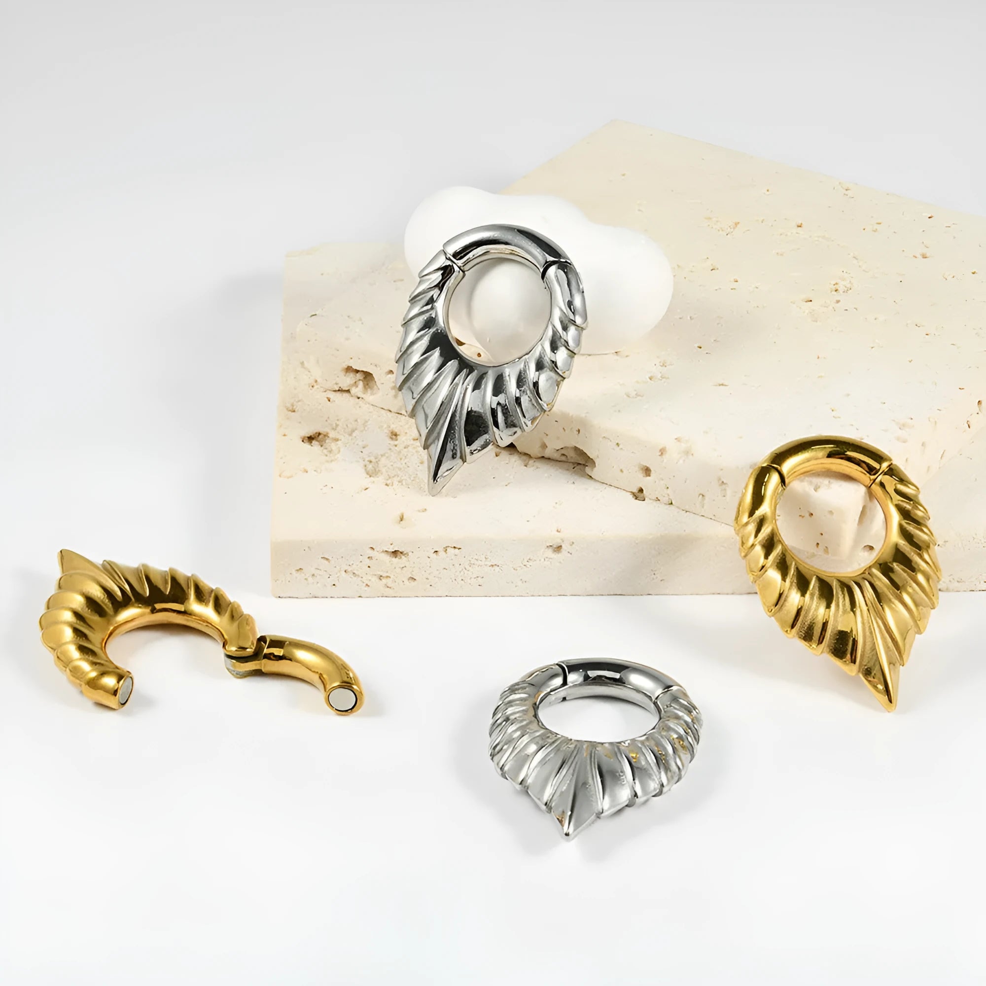 Stainless steel drop-shaped auricle ear extender with round hanging egg and totem pattern.