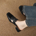 Retro closed toe low heel sandals in genuine leather, square toe, open back, apricot colour, on a neutral background