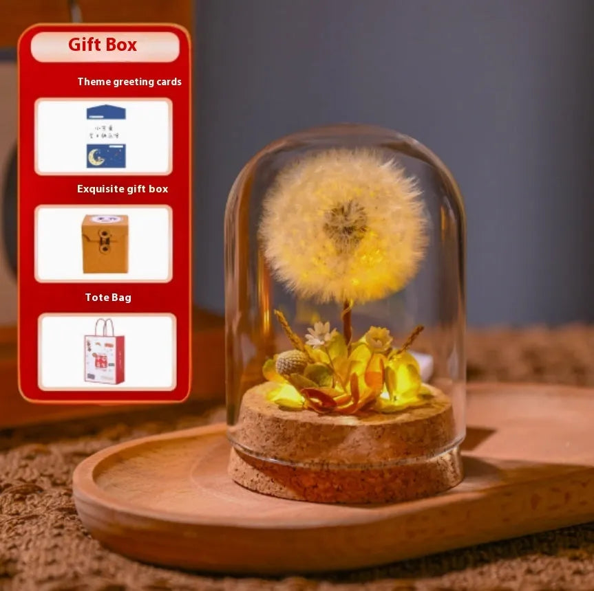 Dandelion-shaped glass night light ornament in gradient colours on wooden surface
