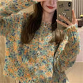 Pink or green retro-style rainbow patterned knitted cardigan on a model.