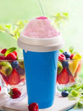 Blue quick cooling pinch cup with double-layer cylindrical design on a table.
