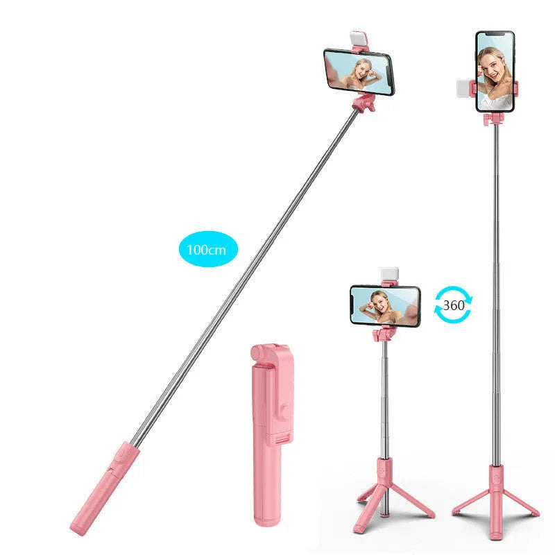 Black Bluetooth selfie stick extended from its integrated mini tripod base, holding a smartphone.