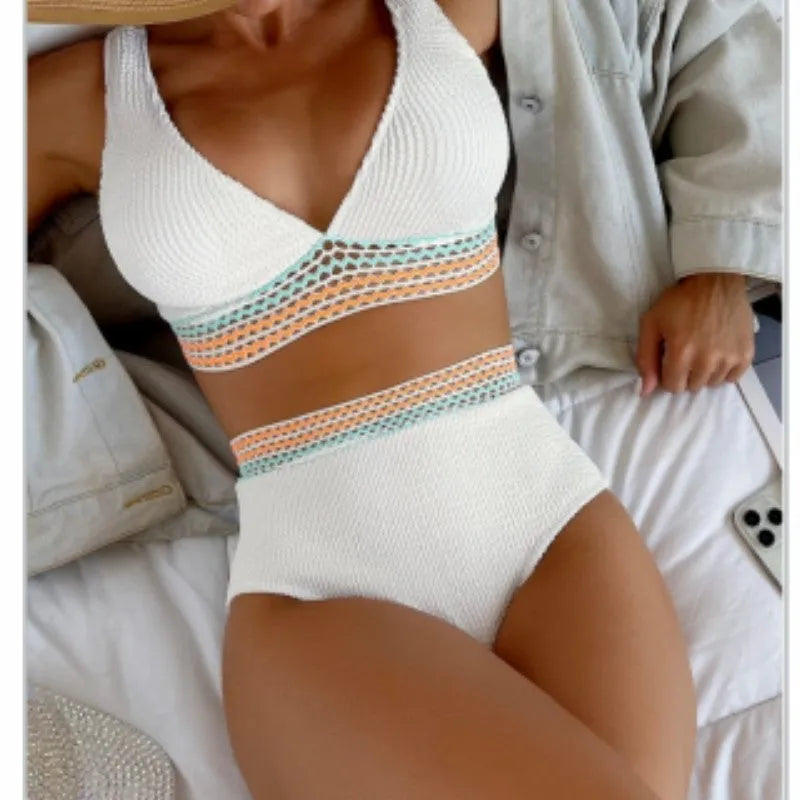White high waist bikini set with sleeveless top on a mannequin