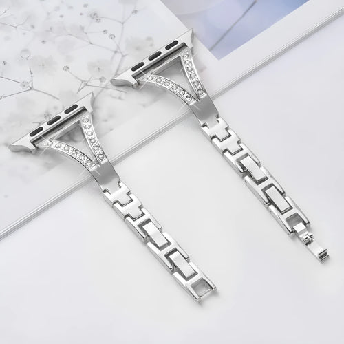 Silver herringbone diamond pattern metal band for Apple Watch on a wrist, showing adjustable links.