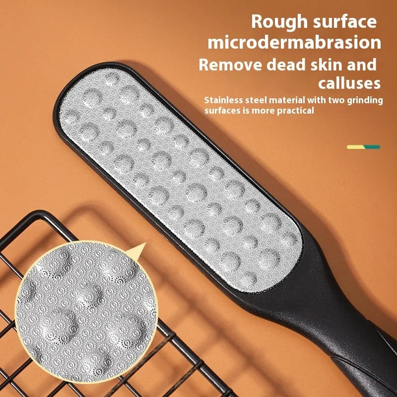 Stainless steel foot grinder with white and black double-sided abrasive attachments for foot care