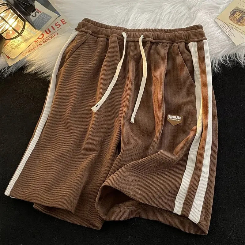 Versatile polyester sports shorts in black, apricot, and dark brown for casual summer couple wear