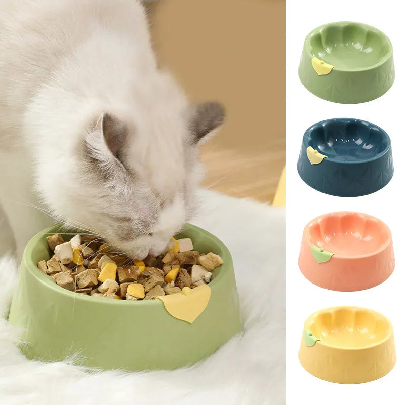 Green plastic double pet bowl for food and water with a flower-shaped, anti-tipping design.
